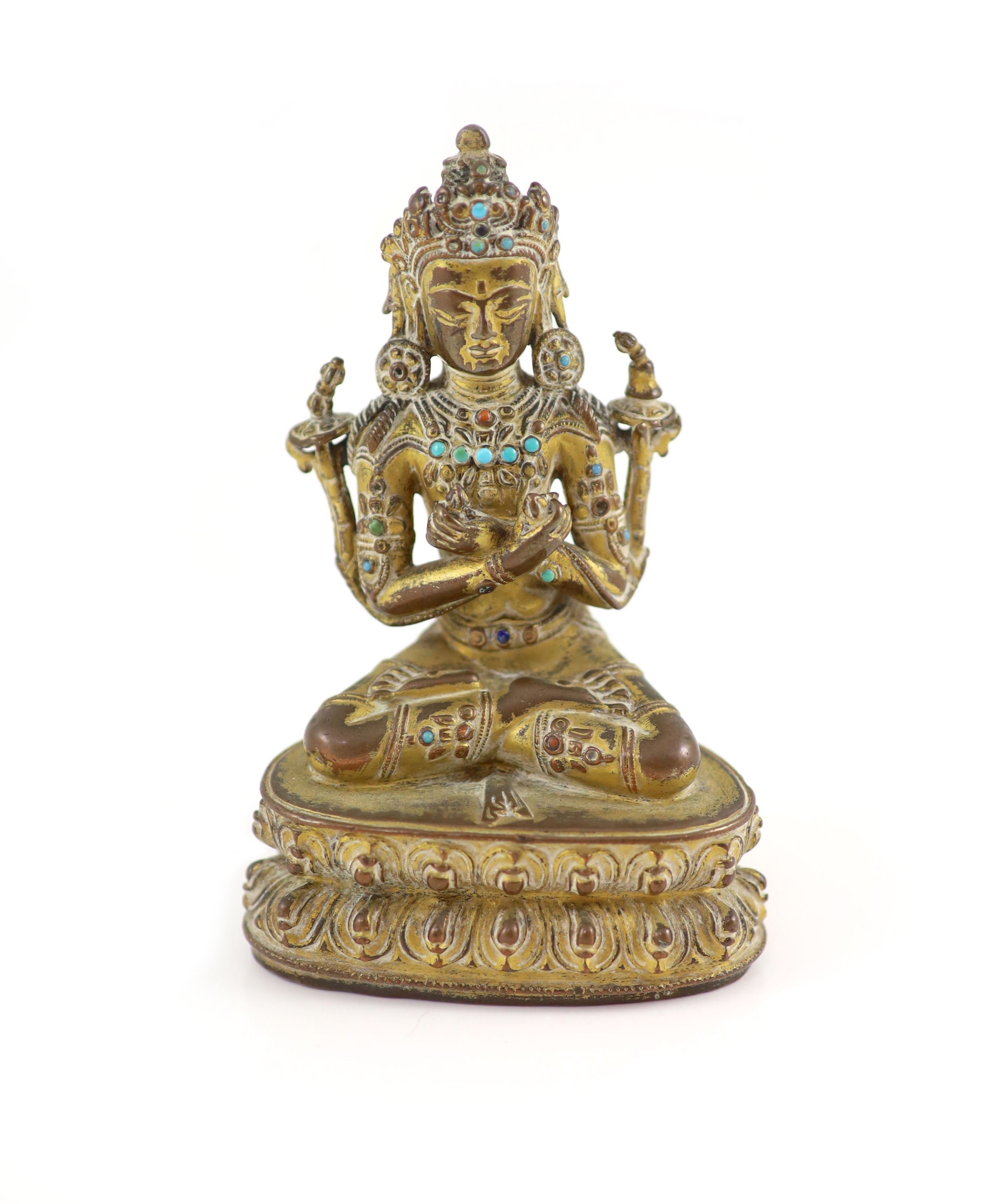 A Tibetan gilt copper alloy seated figure of Maitreya, possibly 15th century, 11.5 cm high